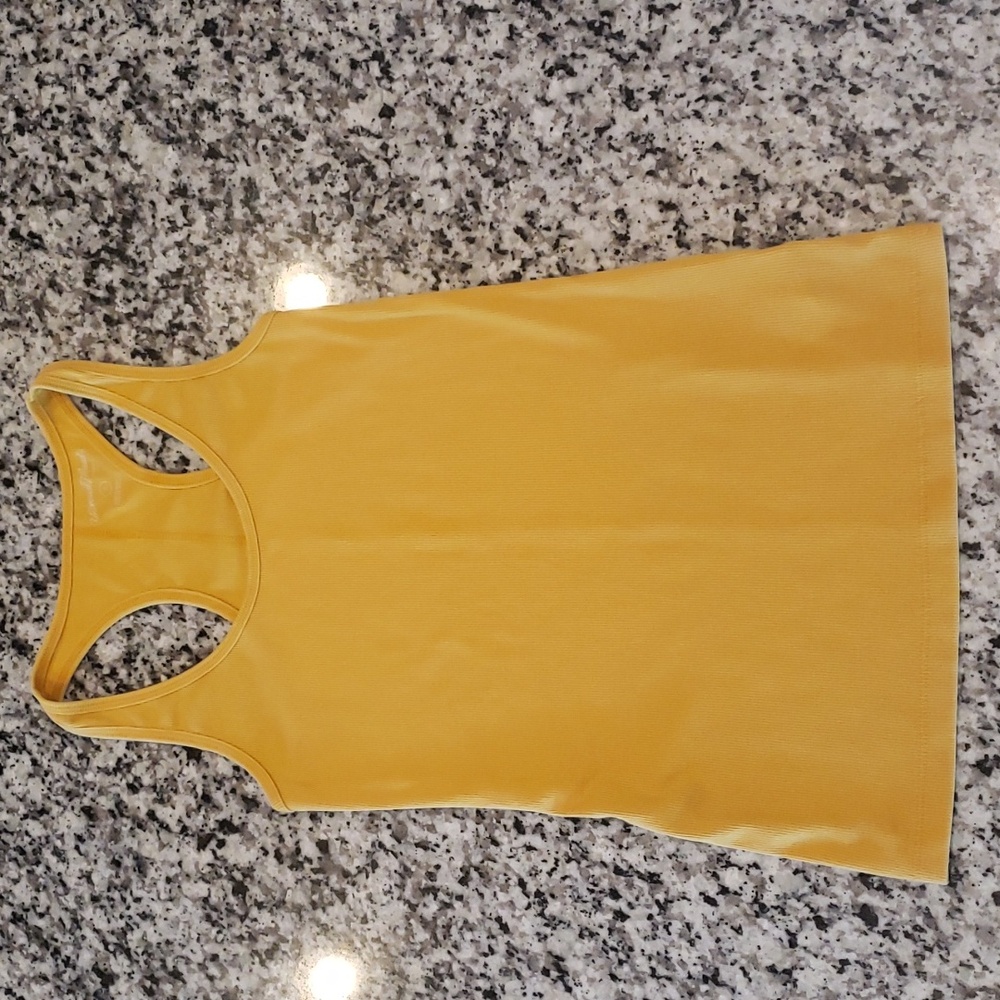 Mustard yellow racerback tank.